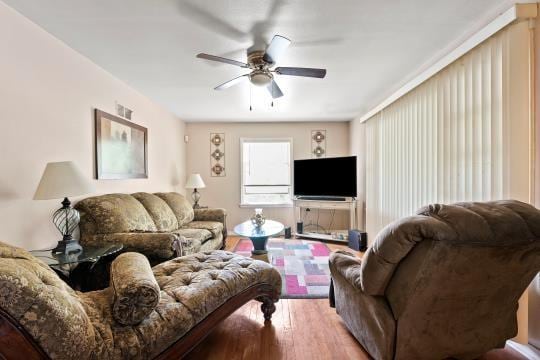 6745 Cleveland Ave, Kansas City, MO 64132 - living room with a ceiling fan and light wood-style flooring