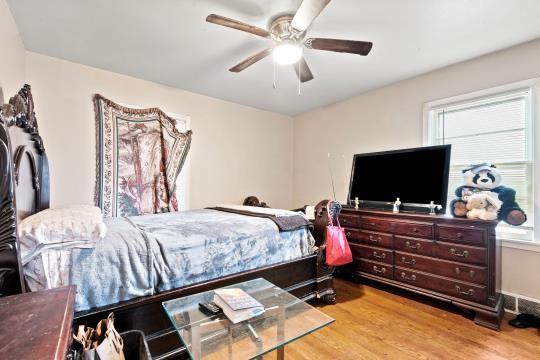 6745 Cleveland Ave, Kansas City, MO 64132 - bedroom featuring ceiling fan and wood finished floors
