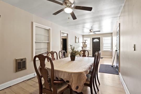 6745 Cleveland Ave, Kansas City, MO 64132 - dining room with baseboards, a ceiling fan, light wood-type flooring, and visible vents