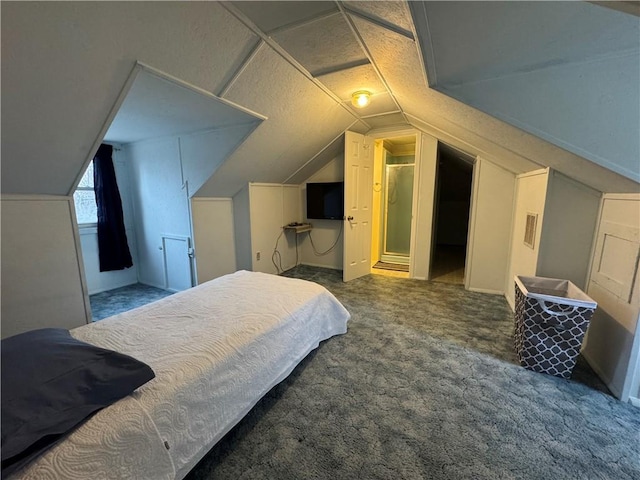 bedroom with vaulted ceiling and carpet floors