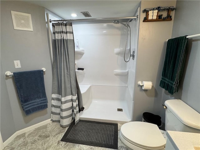 bathroom with visible vents, curtained shower, and toilet