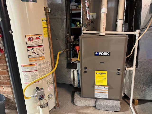 utility room featuring gas water heater