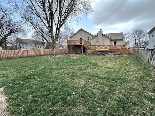 view of yard featuring stairs, a fenced backyard, and a wooden deck