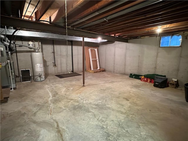 unfinished basement featuring water heater