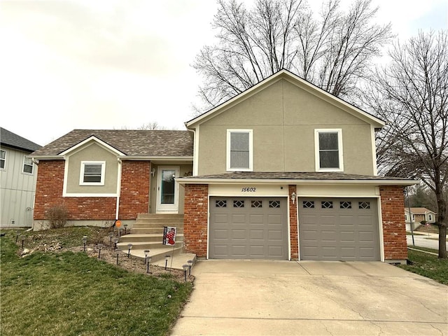 tri-level home featuring a garage, brick siding, driveway, and a shingled roof