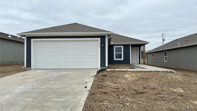 ranch-style house with an attached garage, driveway, and a shingled roof