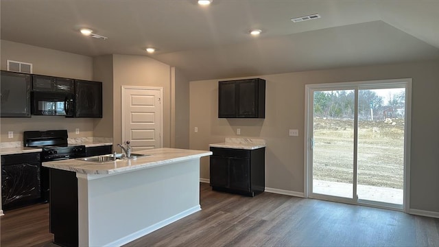 kitchen featuring visible vents, black appliances, dark wood-type flooring, and a sink