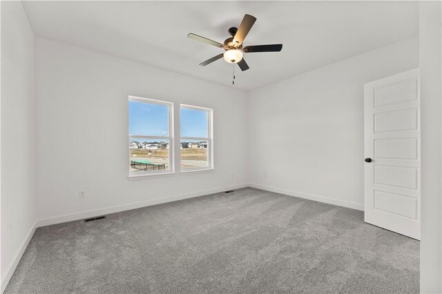 10612 N Jefferson St, Kansas City, MO 64155 - spare room with baseboards, carpet, visible vents, and ceiling fan