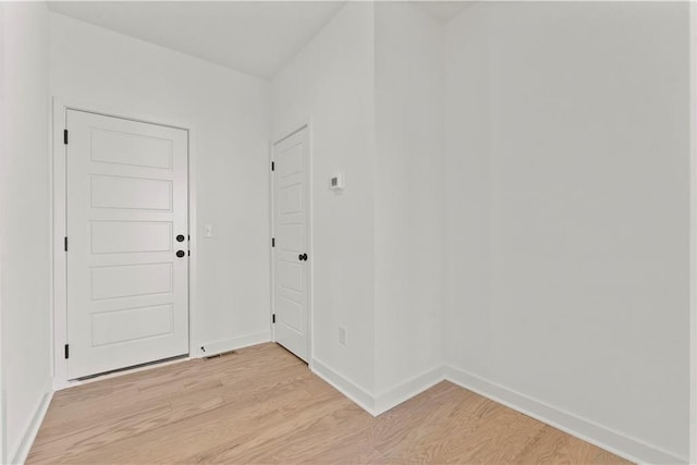 10612 N Jefferson St, Kansas City, MO 64155 - foyer entrance featuring light wood-style floors and baseboards