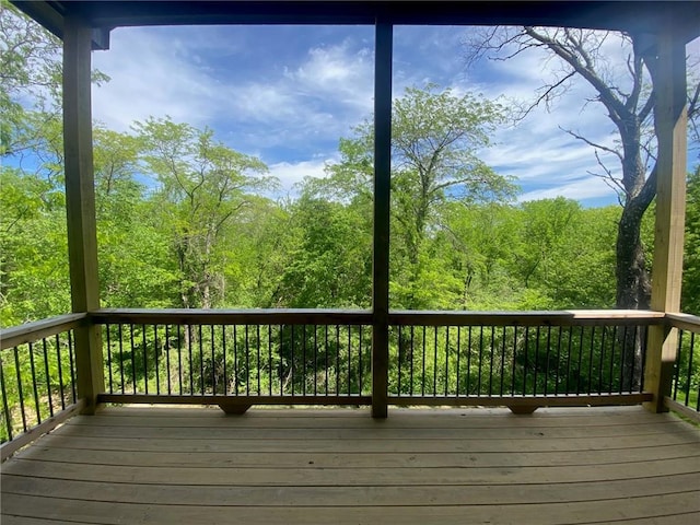 4822 NE 105th St, Kansas City, MO 64156 - wooden terrace with a view of trees