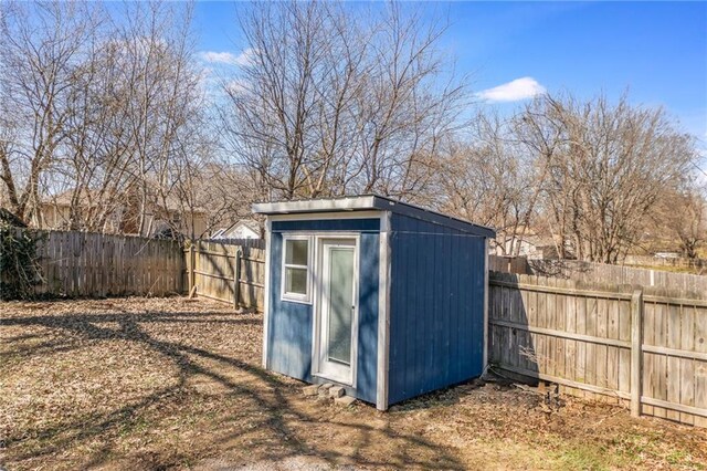 view of shed with a fenced backyard
