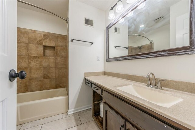 full bathroom with tile patterned floors, visible vents, shower / bathtub combination, and vanity