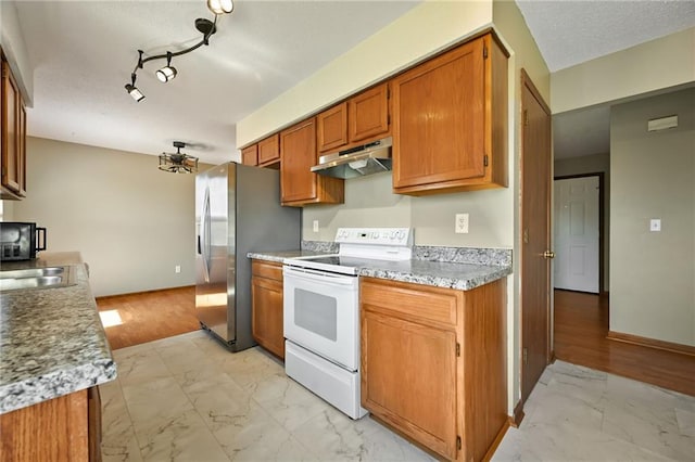 kitchen with brown cabinets, marble finish floor, stainless steel refrigerator with ice dispenser, white electric range, and under cabinet range hood