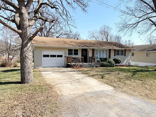 ranch-style home featuring a front lawn, an attached garage, driveway, and a chimney