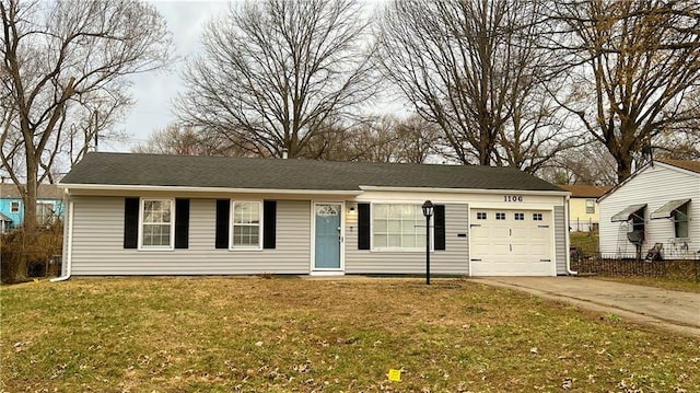 ranch-style house featuring a garage, concrete driveway, and a front lawn