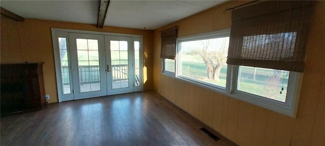 20824 NE 172nd St, Holt, MO 64048 - interior space with visible vents, french doors, wooden walls, and wood finished floors