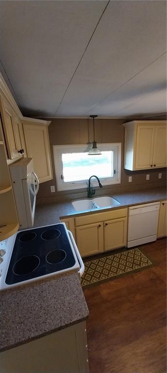 20824 NE 172nd St, Holt, MO 64048 - kitchen with a sink, cream cabinets, washer / dryer, white appliances, and dark wood-type flooring