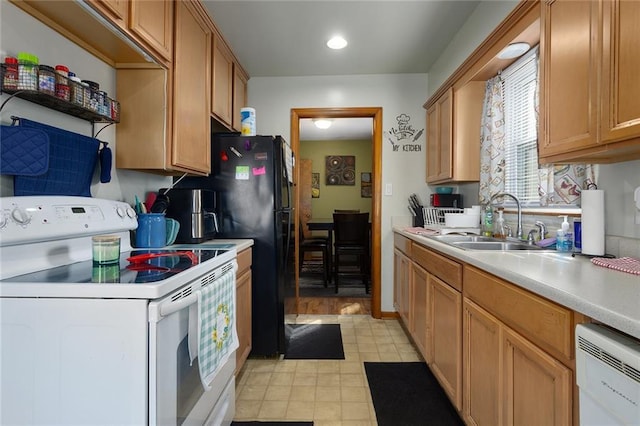 kitchen featuring a sink, white appliances, brown cabinets, and light countertops