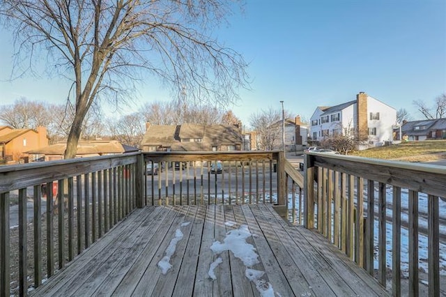 wooden terrace with a residential view