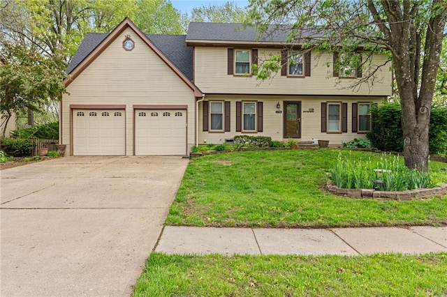 119 Willow Dr, Lansing, KS 66043 - colonial home with an attached garage, driveway, and a front lawn