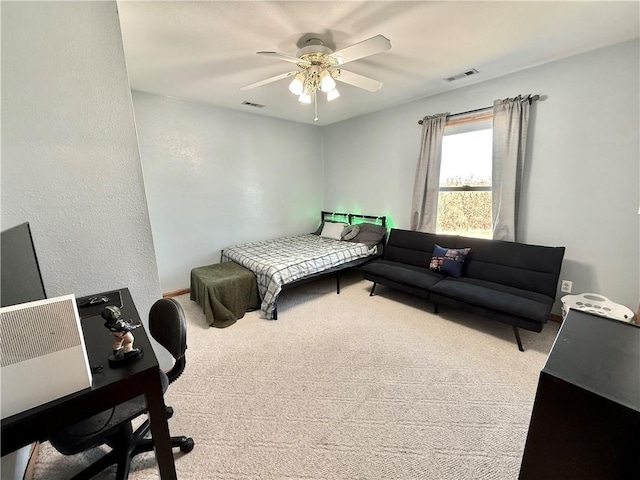 bedroom with visible vents, ceiling fan, and carpet