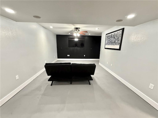rec room with finished concrete flooring, recessed lighting, a ceiling fan, and baseboards
