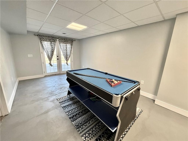 game room with french doors, concrete flooring, baseboards, and billiards