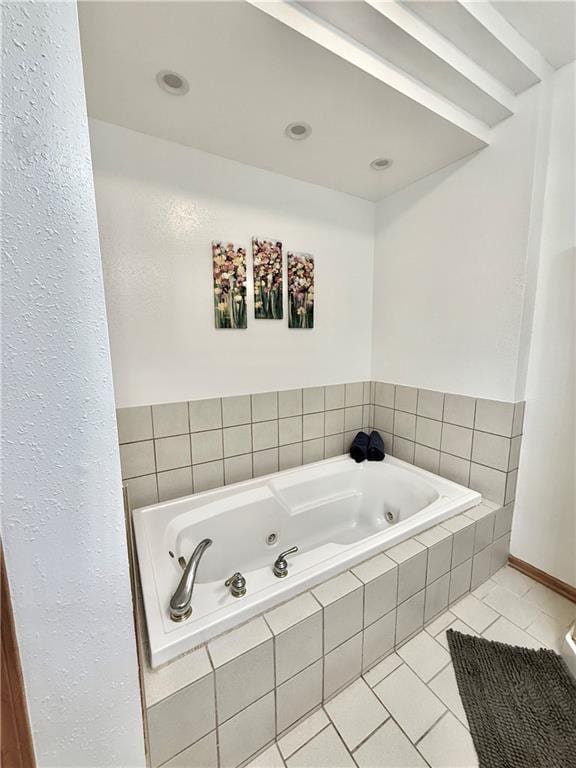 full bathroom featuring tile patterned flooring and a tub with jets