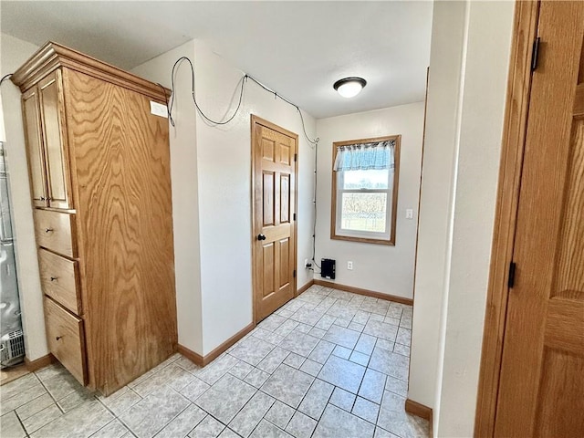 interior space featuring baseboards
