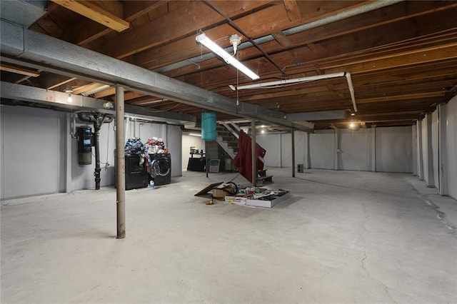 unfinished basement featuring stairway