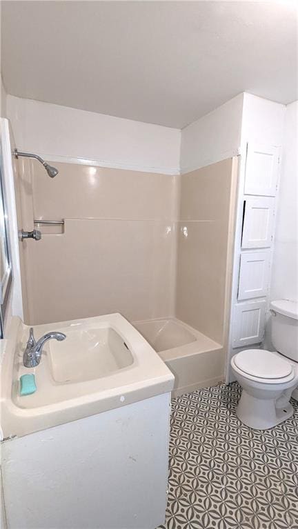 bathroom with vanity, bathing tub / shower combination, toilet, and tile patterned flooring