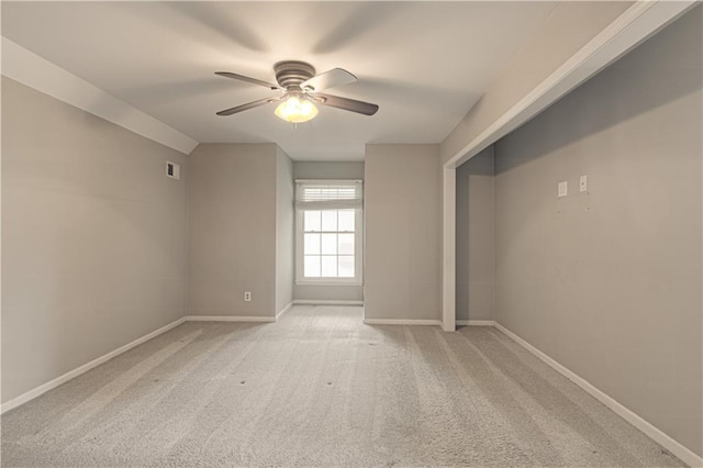 11643 Glen Arbor Ter, Kansas City, MO 64114 - spare room with a ceiling fan, baseboards, and light carpet
