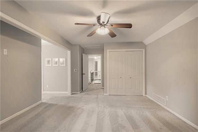 11643 Glen Arbor Ter, Kansas City, MO 64114 - unfurnished bedroom featuring light colored carpet, baseboards, ceiling fan, and a closet