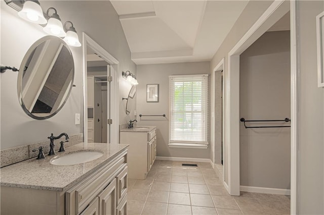 11643 Glen Arbor Ter, Kansas City, MO 64114 - full bathroom with two vanities, baseboards, and tile patterned floors