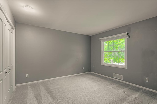 11643 Glen Arbor Ter, Kansas City, MO 64114 - carpeted spare room with baseboards