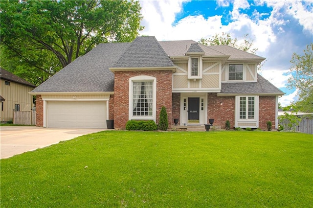11643 Glen Arbor Ter, Kansas City, MO 64114 - view of front facade with a garage, driveway, brick siding, and a shingled roof