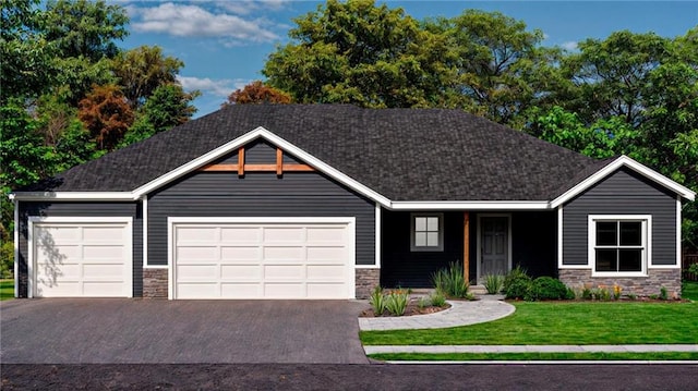 view of front of house featuring stone siding, driveway, an attached garage, and a front yard