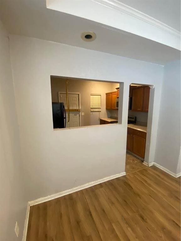 interior space with baseboards and dark wood finished floors