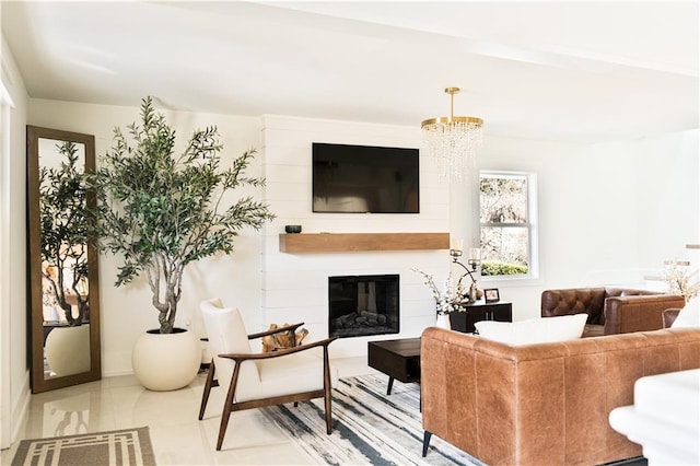tiled living room featuring a chandelier and a large fireplace