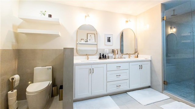 full bath featuring toilet, a stall shower, and a sink