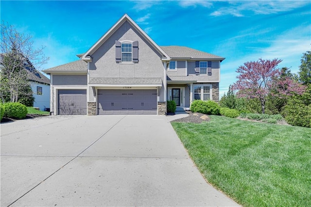 view of front of property featuring a front yard, concrete driveway, an attached garage, stone siding, and stucco siding