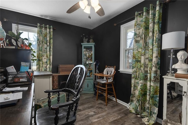 office featuring baseboards, wood finished floors, a healthy amount of sunlight, and ceiling fan