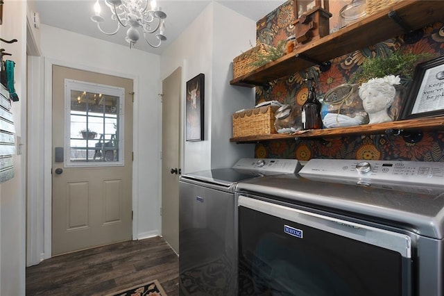 laundry room with a chandelier, dark wood-style floors, washing machine and dryer, and laundry area