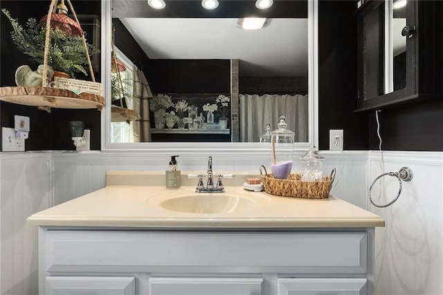 bathroom featuring vanity and wainscoting