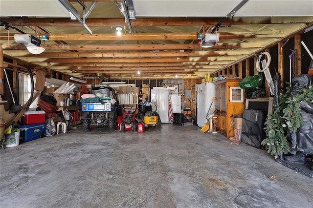 garage featuring a garage door opener