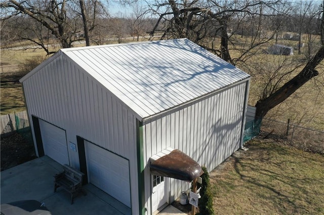 view of outbuilding featuring an outbuilding and fence