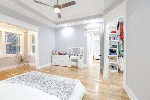 bedroom with light wood-style floors and baseboards