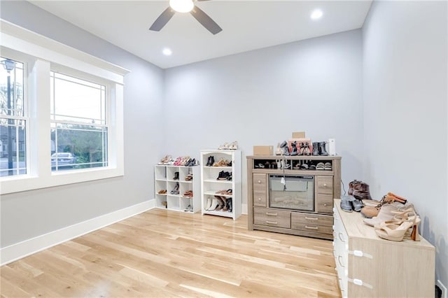 playroom with baseboards, light wood-type flooring, recessed lighting, and a ceiling fan