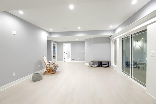 unfurnished room featuring wood finished floors, baseboards, visible vents, and recessed lighting