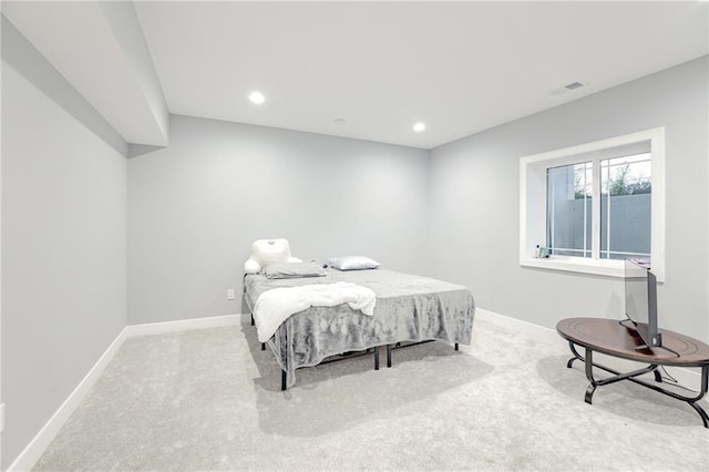 carpeted bedroom featuring recessed lighting, visible vents, and baseboards